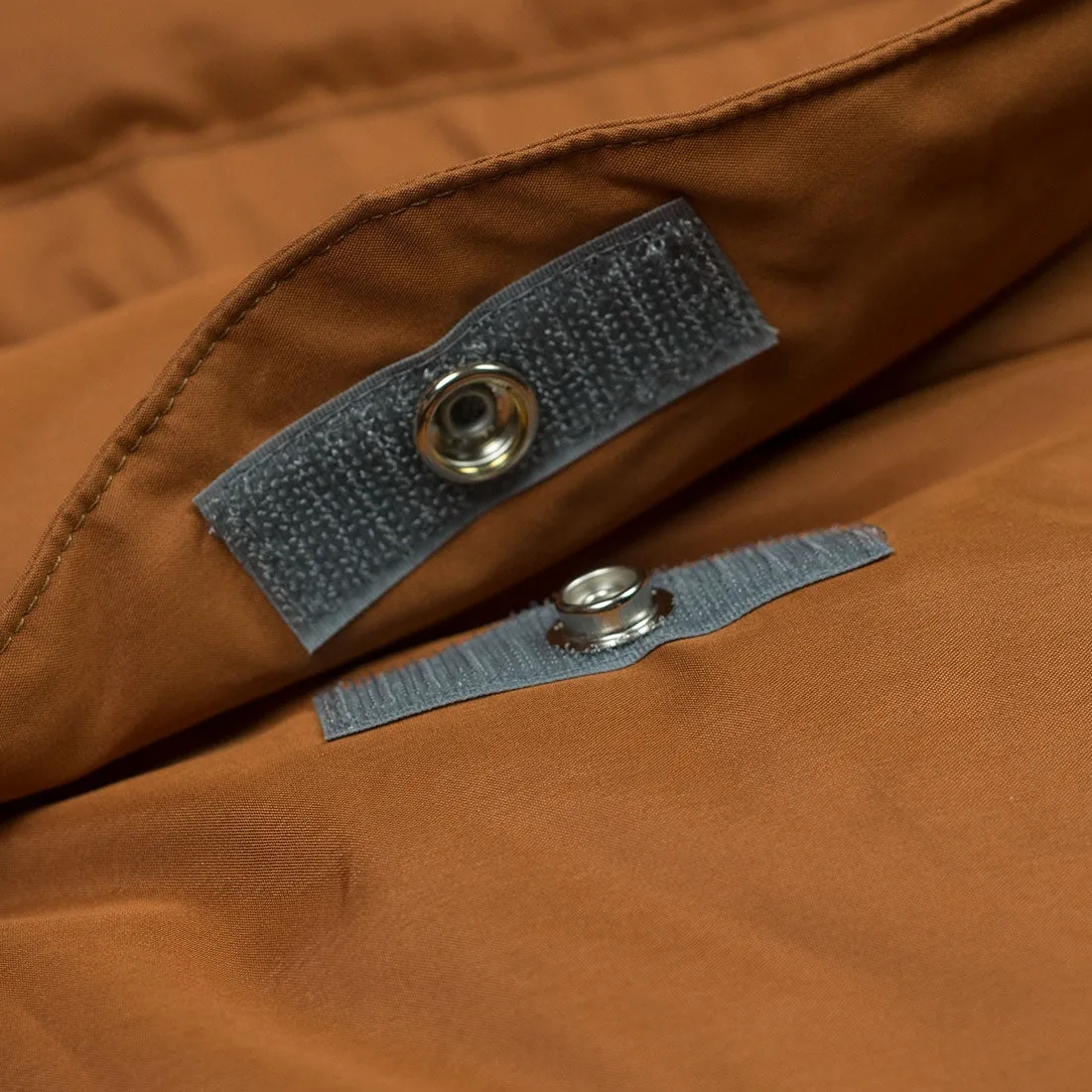 "Expedition Down Parka" in walnut orange